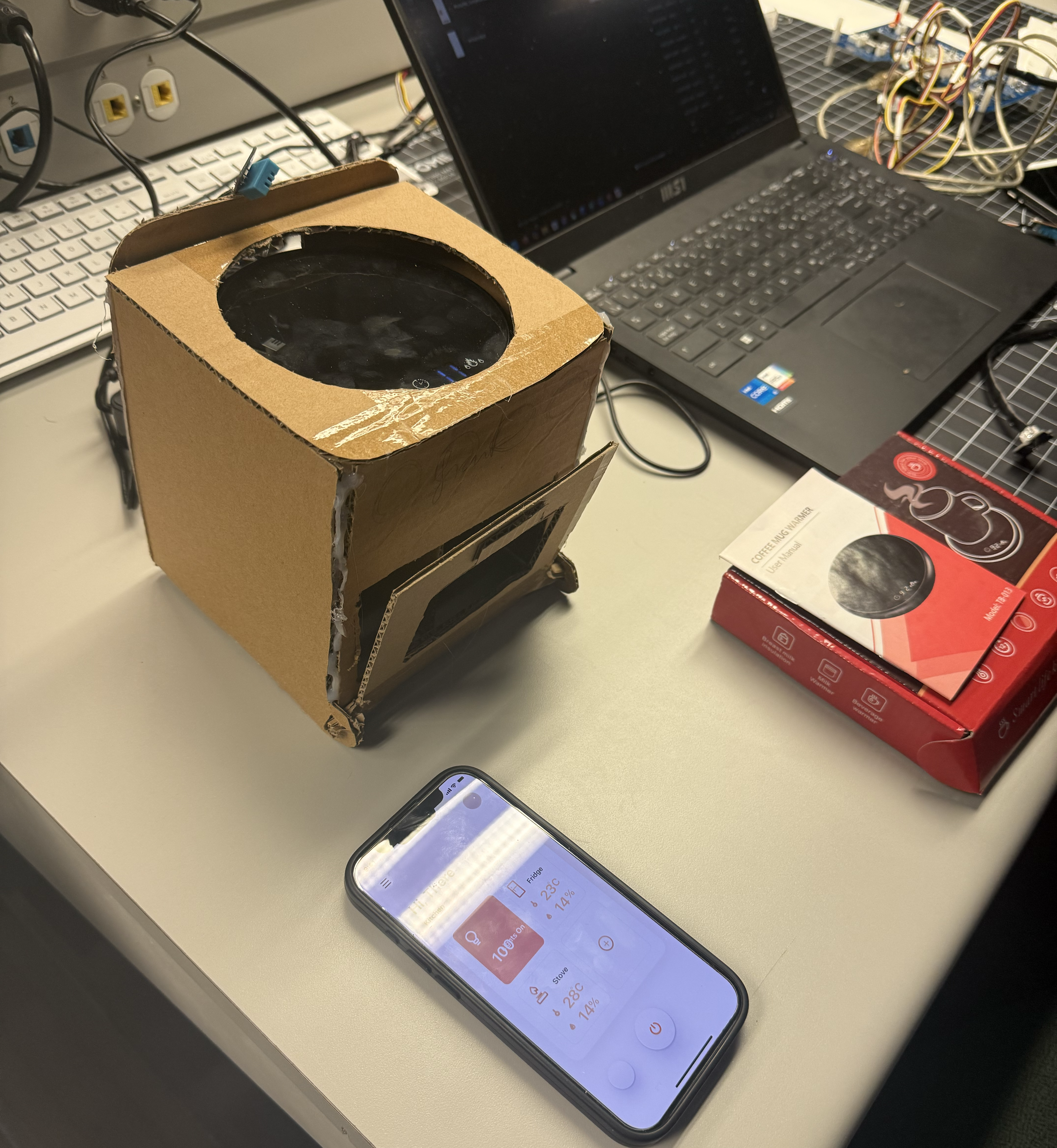 Testing the cardboard stove with a headed coaster with the temperature sensor and the ProtoPie prototype. We were seeing how long it took the temperature to change (increase) when the heated coaster was acting as the stove top. It took about 6 minutes to change temperature and the temperature change was showing up faster on the arduino than the digital interface on ProtoPie.